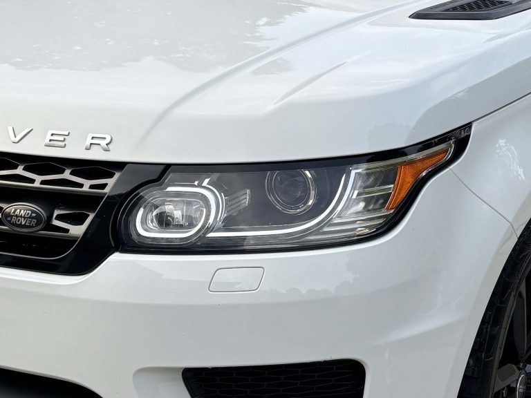 A Range Rover with a fresh headlight detail job done by Charlotte's Mobile Detailing.