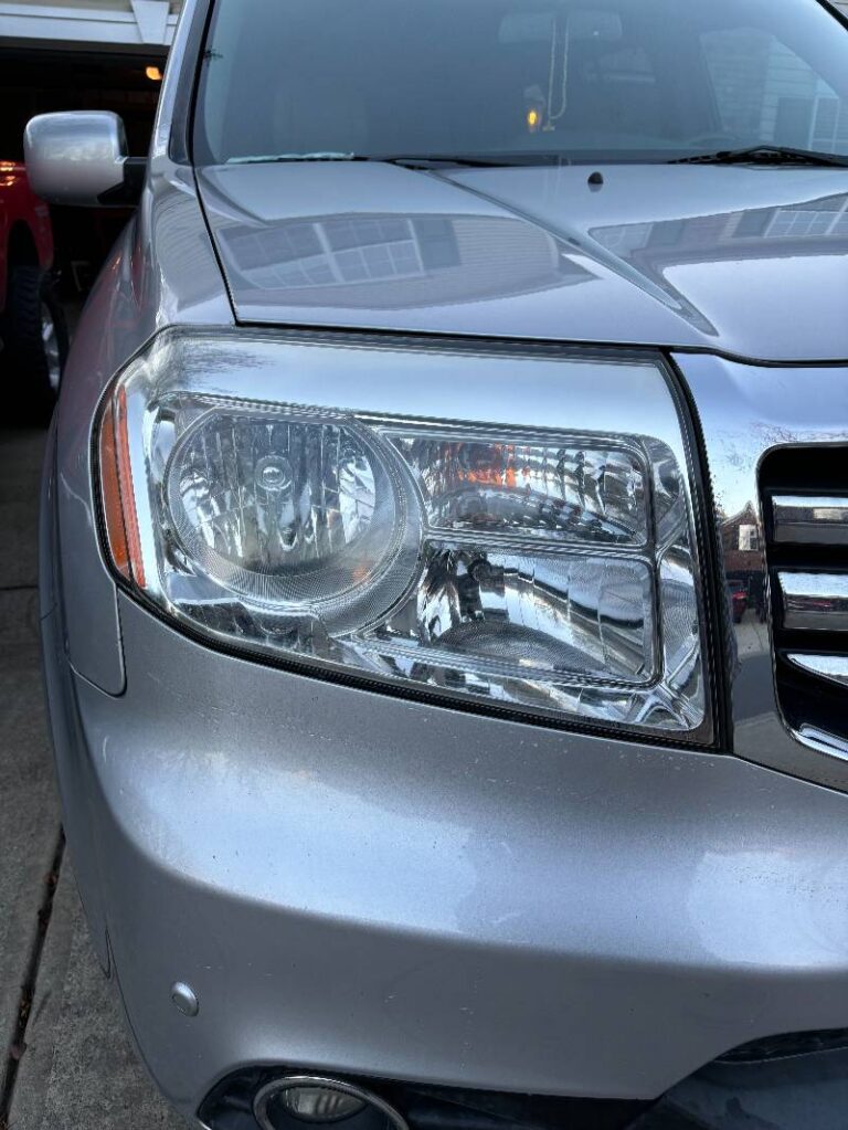 Angle 2 of a recent headlight restoration job on a Honda by Charlotte's Mobile Detailing.
