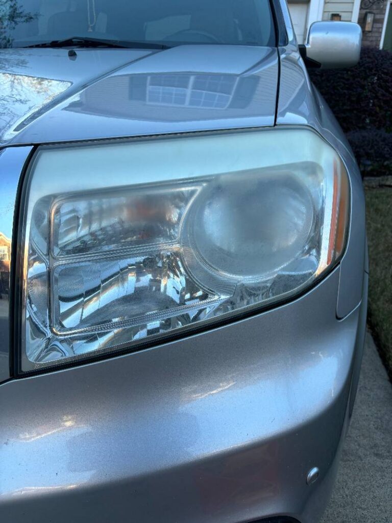 Angle 2 of a Honda before headlight restoration.